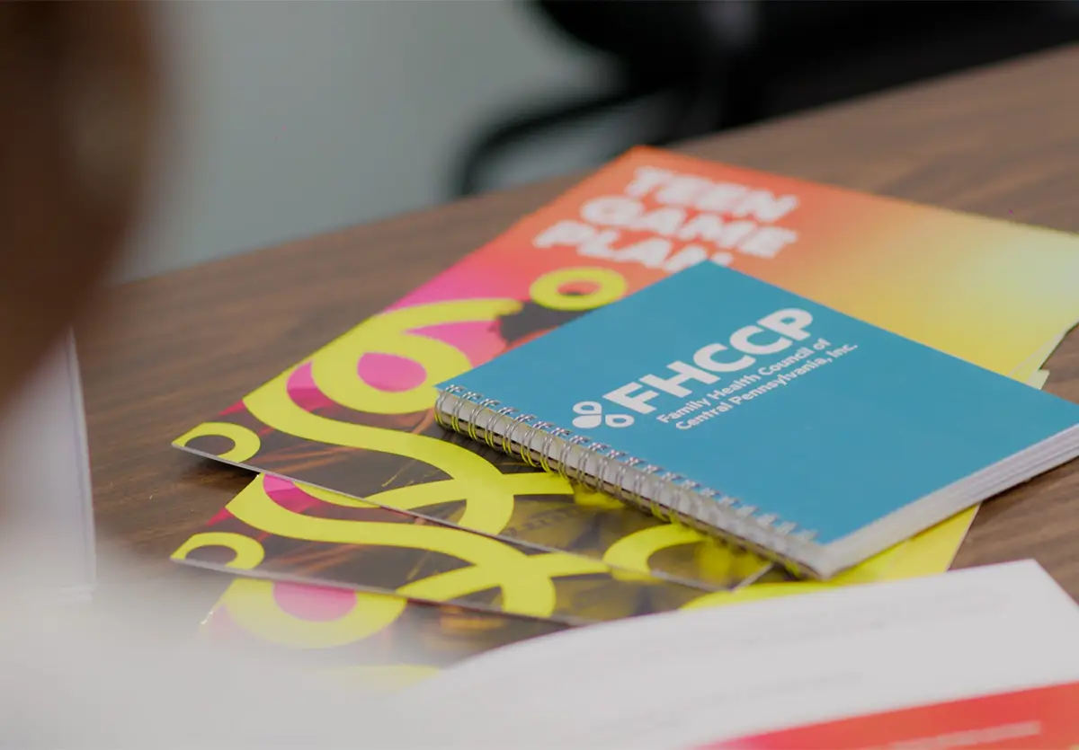 FHCCP-branded notebok and educational booklets.